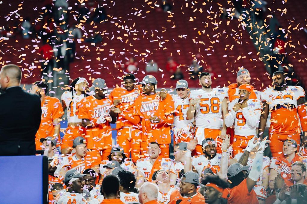 The Clemson Football Team winning