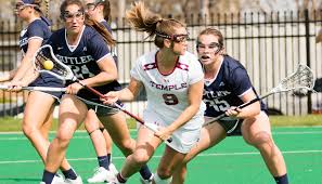 women at a game playing lacrosse