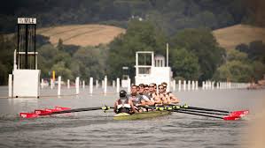 the men rowing on the water