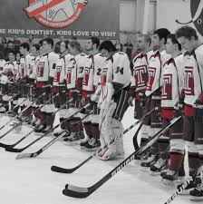 group of students with their hockey sticks