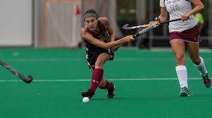 a student on the field going for the ball