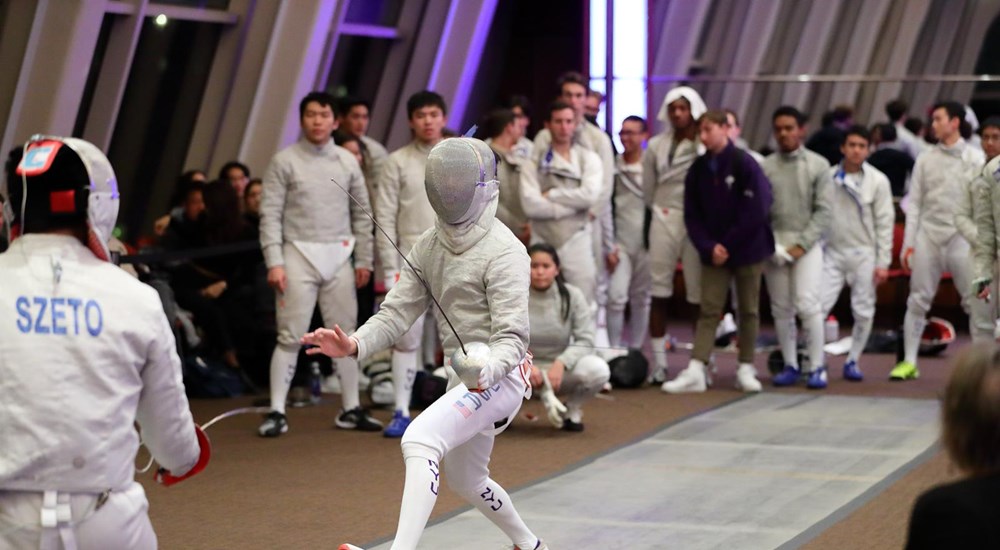 Two fencers competing against each other