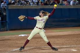 a girl getting read to pitch the ball