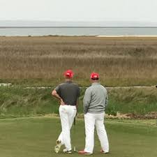 two golf players on the course