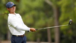 a golf player swinging