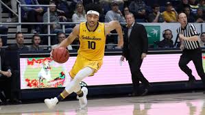 a basketball player with the ball