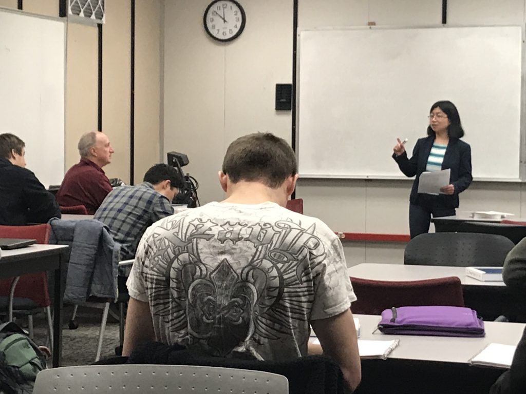 Professor teaching students in class.