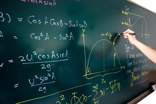 Math problems being solved on the board.