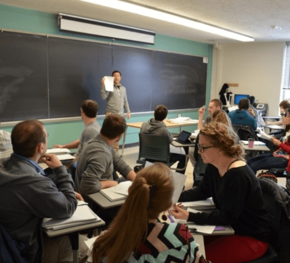 a professor teaching a classroom of students