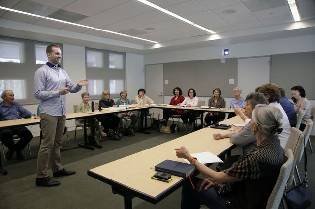 Student presenting to faculty in class. 