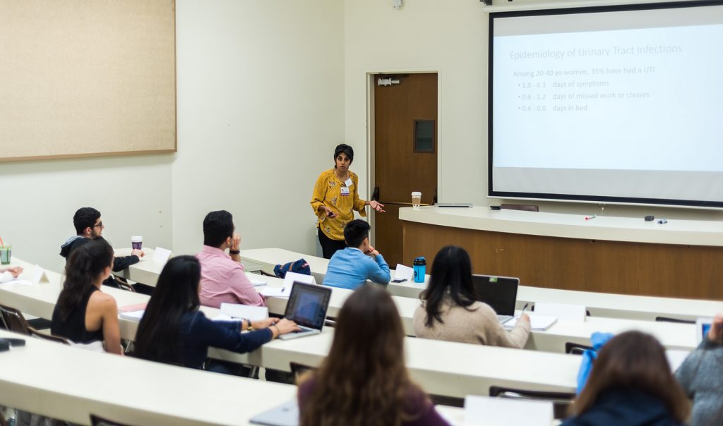 Professor teaching to students in class. 