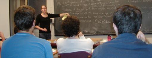 A professor instructing a math class