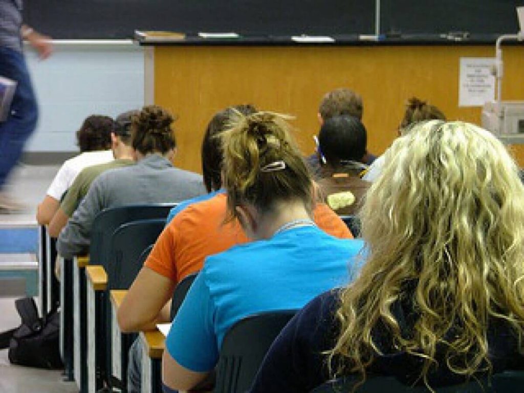 Students sitting in a row in class.