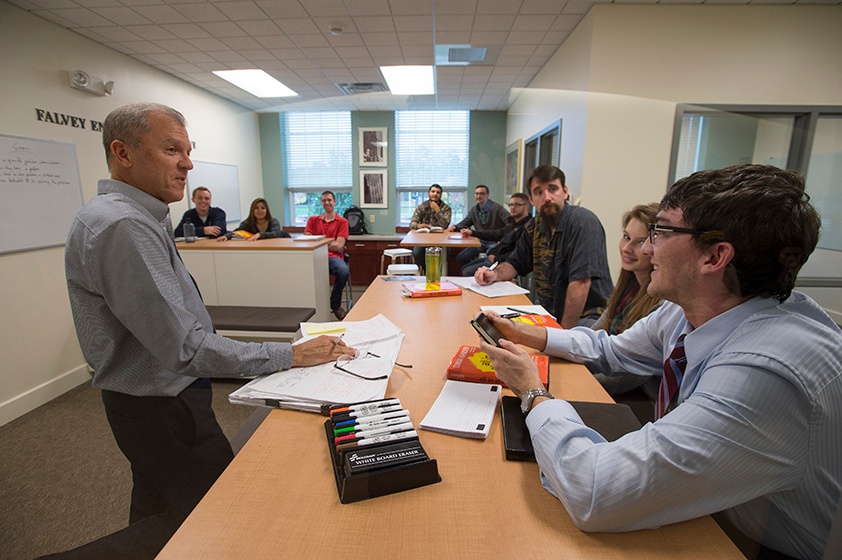 Professor working with students in class at Langara