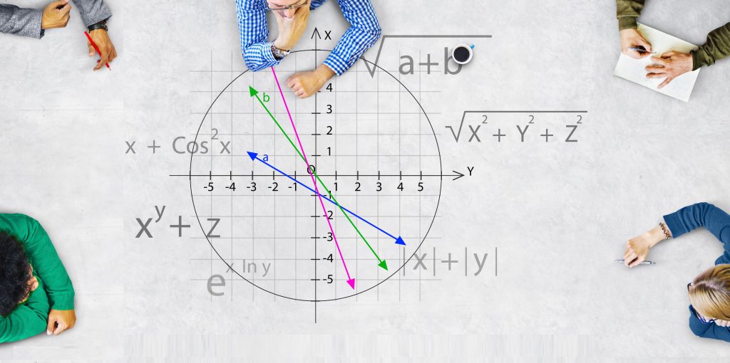students sitting around the table with unit square and other math equations