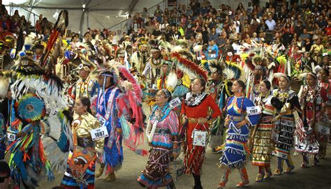 Native Americans walking next to each other.
