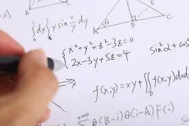 Liberty University student doing math problems on a piece of paper